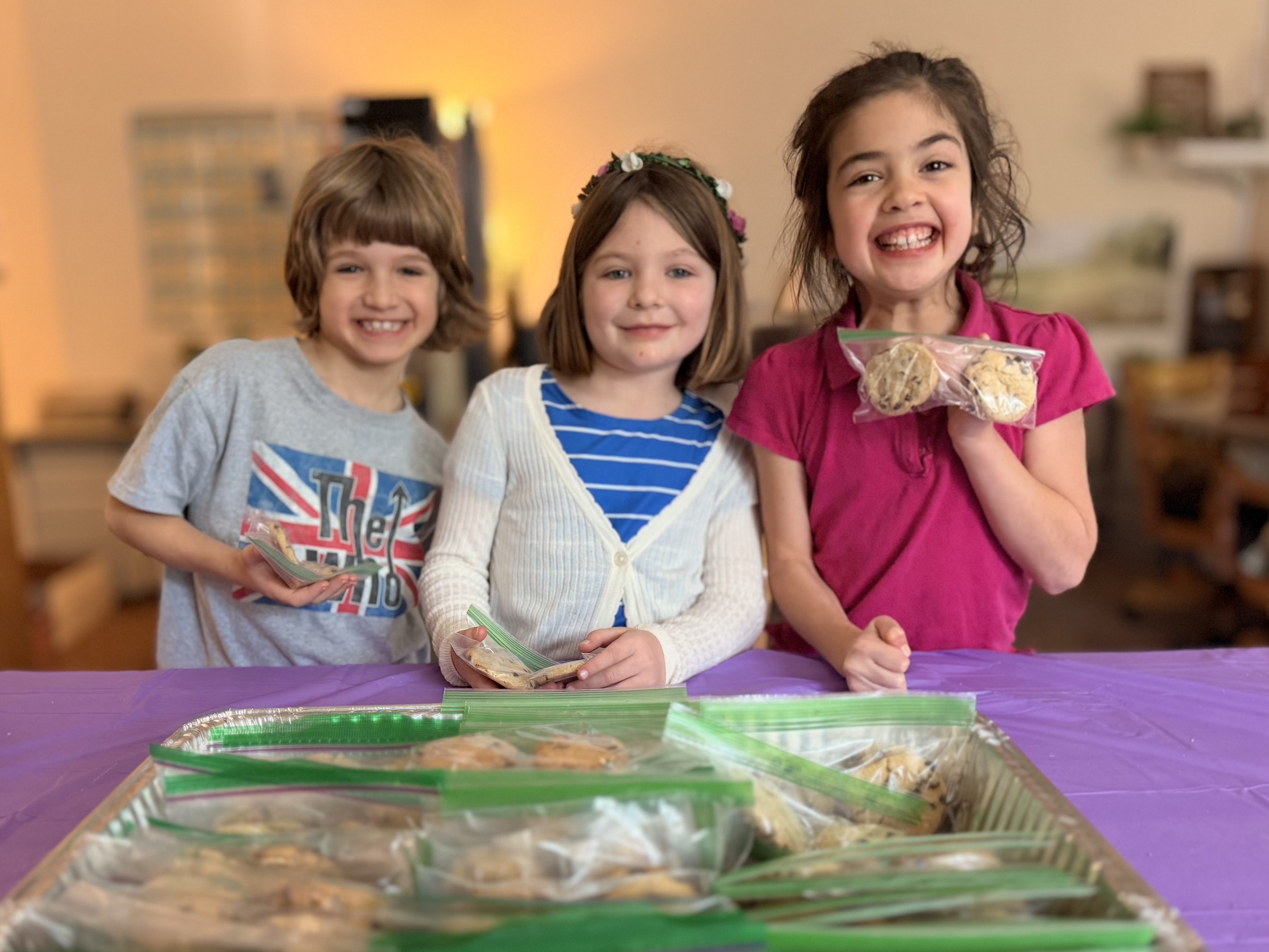 Second grade students packaging cookies for a school fundraiser